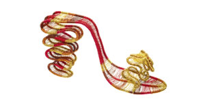 A sculptural red high-heeled sandal made of coiled gold and red wire