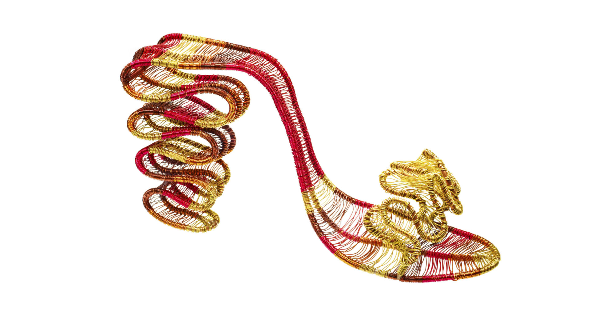 A sculptural red high-heeled sandal made of coiled gold and red wire