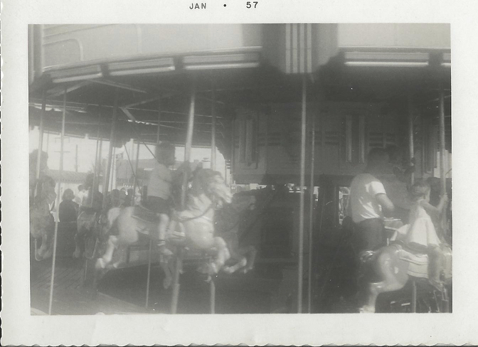 An old black-and-white photo of a carousel