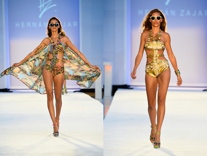 Two models on the runway, one in a sheer printed cover-up, one in a gold swimsuit