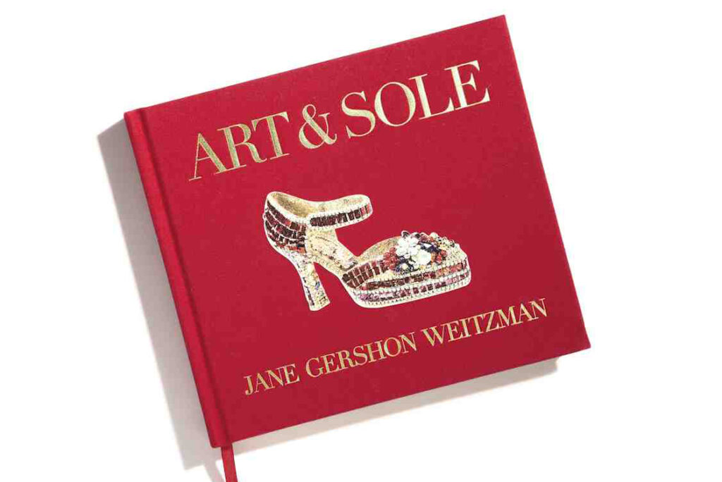 The red cover of Jane Gershon Weitzman's book Art & Sole, showing a jewelled shoe