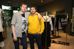 The designers of Creatures of the Wind, two men posing in a clothing store