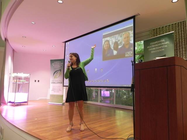 Amy Padolf speaking to NASA scientists on a big screen via Skype