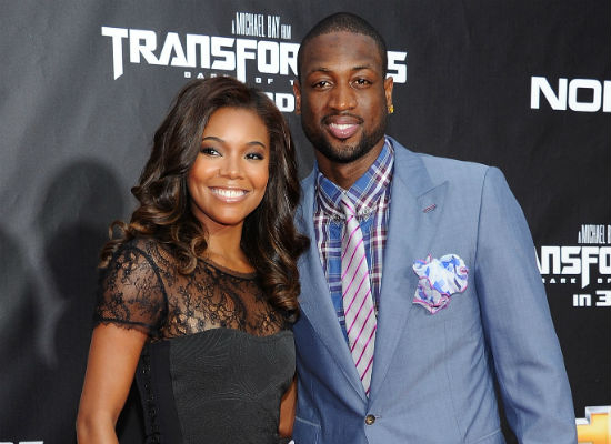 Gabrielle Union and Dwyane Wade posing together at a Transformers premiere