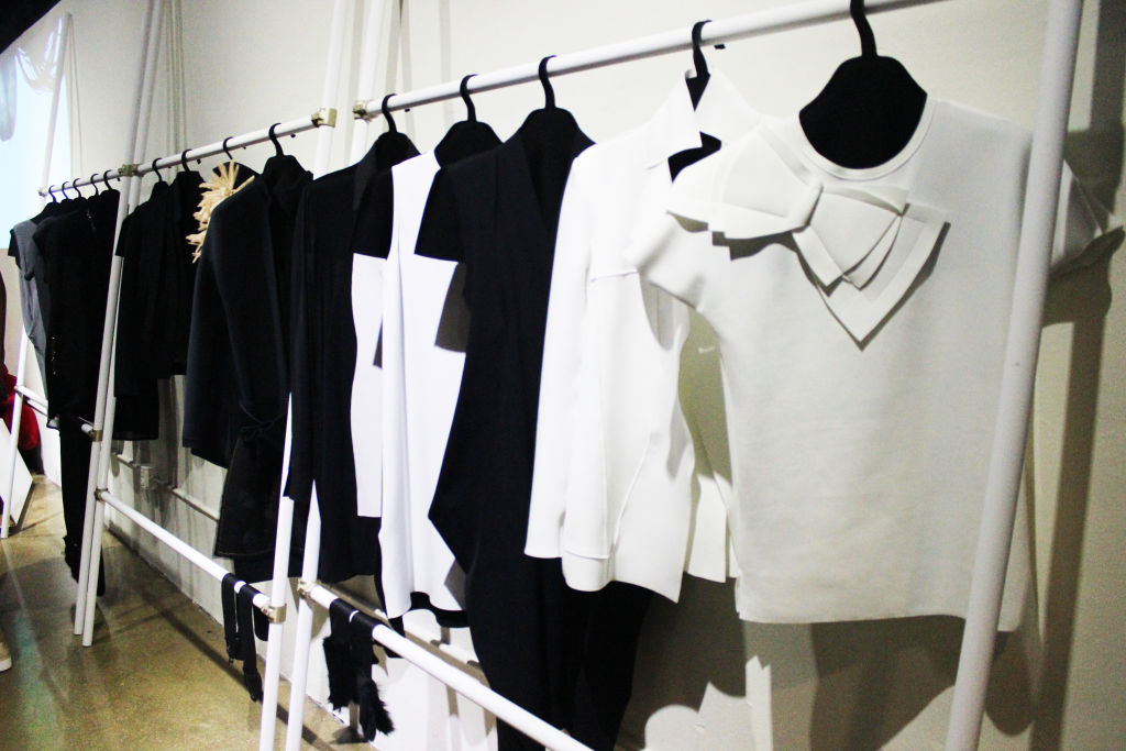 A rail of black and white tops and dresses