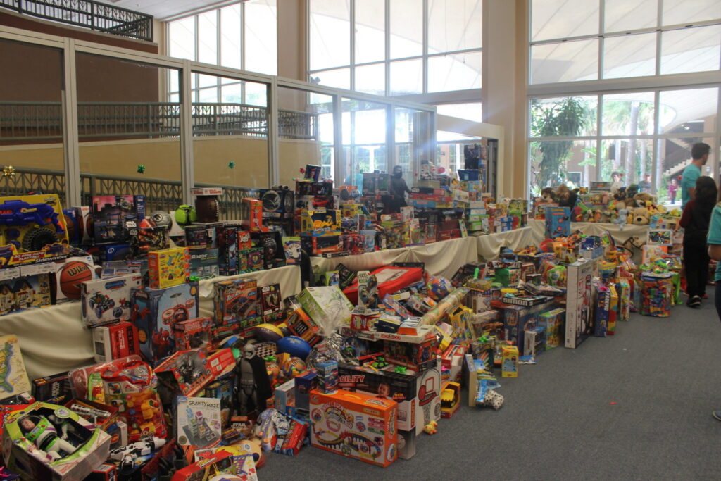 A large hall filled with rows of donated toys