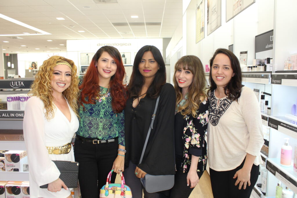 Five women posing together in an Ulta store at a launch party