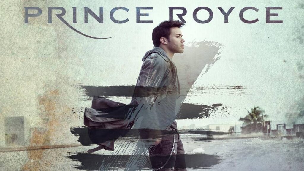 The cover of Prince Royce's album FIVE, with him walking in a long coat