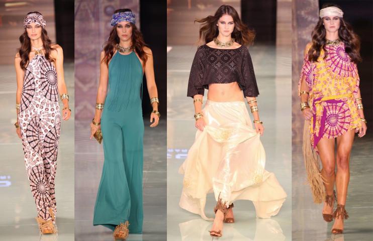 Four models in bohemian prints, a teal jumpsuit, a cream skirt and a patterned kaftan on a runway