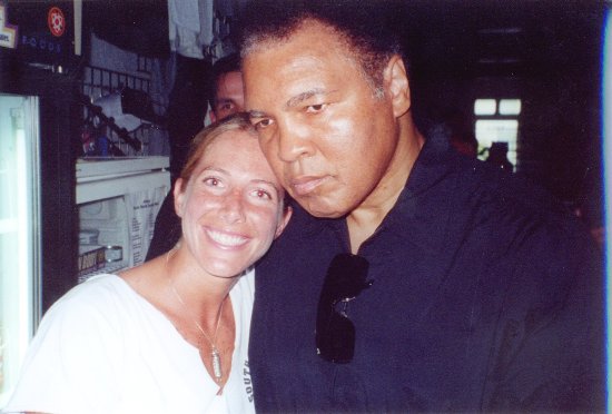 An old snapshot of Jolie Glassman cheek to cheek with an older man in a dark shirt