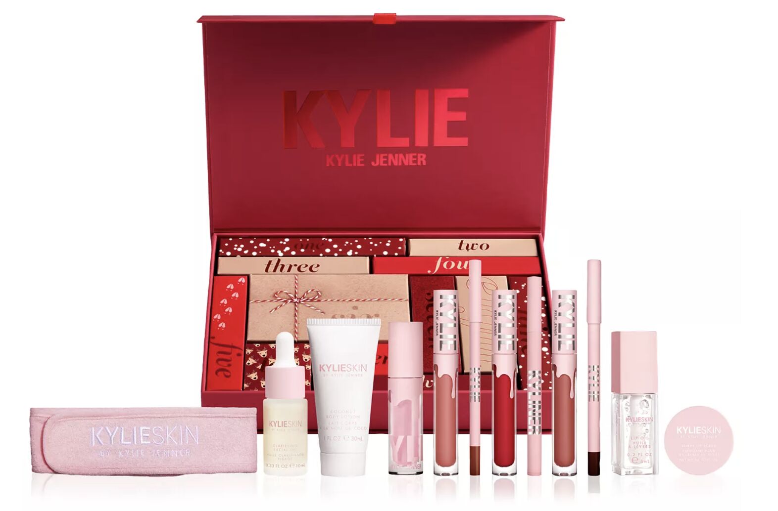 The 12 Days of Kylie advent calendar: a red box of numbered drawers with lip glosses, liners and Kylie Skin products laid out in front